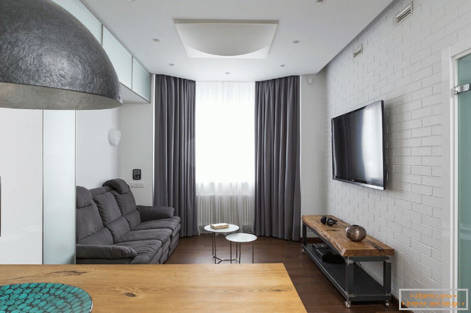 Obývací pokoj v apartmánu s řízeným osvětlením