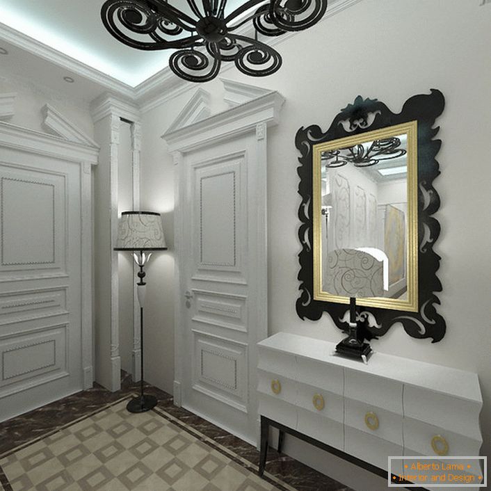 Ve stylu art deco se v interiéru líbí světlé odstíny. Vchod, zdobený bílou, je pozoruhodný pro správně vybrané kontrastní dekorativní prvky.