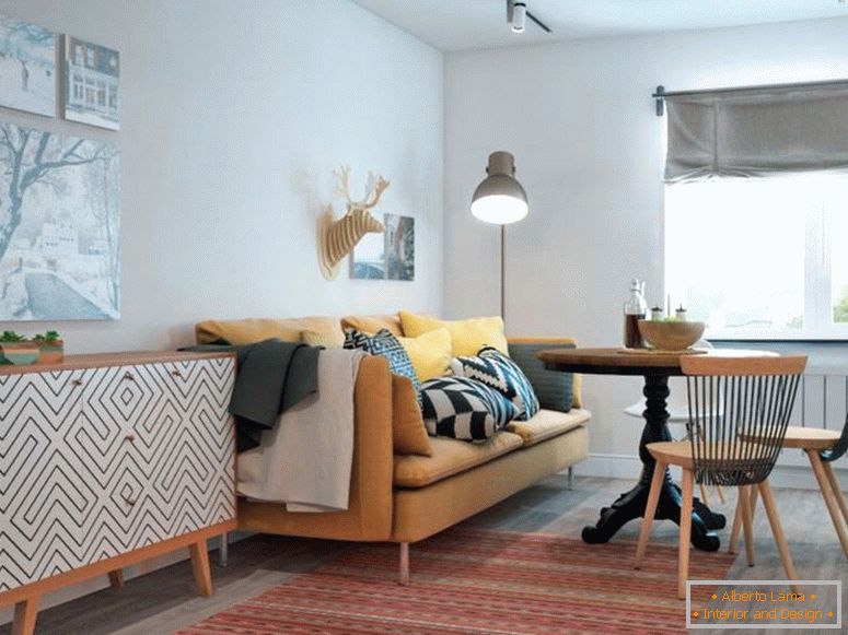obývací pokoj v bílé barvě s pohovkou a kulatým stolem