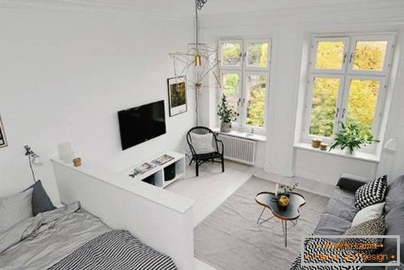 Jednopokojový apartmán ve skandinávském stylu - obývací pokoj a ložnice